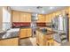 Well-equipped kitchen with stainless steel appliances, granite countertops, and ample cabinet space at 9836 La Vid Ct, Las Vegas, NV 89117