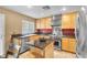 Updated kitchen featuring stainless steel appliances and stone countertops at 9836 La Vid Ct, Las Vegas, NV 89117