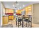 Eat-in kitchen with stainless appliances and a breakfast bar at 9836 La Vid Ct, Las Vegas, NV 89117