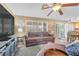 Comfortable living room featuring a plush sofa and lots of natural light at 9836 La Vid Ct, Las Vegas, NV 89117