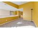 Loft area with neutral carpeting, railing, and lots of sunlight at 9836 La Vid Ct, Las Vegas, NV 89117
