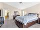 Comfortable main bedroom with a ceiling fan, and neutral carpeting at 9836 La Vid Ct, Las Vegas, NV 89117