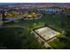 An aerial view shows a community park featuring green spaces, walking paths, pickleball courts and gathering spaces at 1109 Scarlet Sparrow St, Henderson, NV 89011