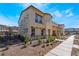 Landscaped front yard with a well-maintained two-story home under a blue sky at 1109 Scarlet Sparrow St, Henderson, NV 89011