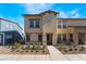 A charming two-story home with a landscaped front yard on a sunny day at 1109 Scarlet Sparrow St, Henderson, NV 89011