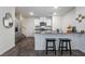 Stylish kitchen featuring stainless steel appliances, a breakfast bar, and granite countertops at 1109 Scarlet Sparrow St, Henderson, NV 89011