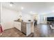 Open-concept kitchen with granite countertops and stainless steel dishwasher flowing into dining and living areas at 1109 Scarlet Sparrow St, Henderson, NV 89011