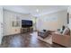 Bright living room with hardwood floors, modern furnishings, and natural light at 1109 Scarlet Sparrow St, Henderson, NV 89011