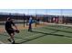 Residents enjoy a fun game of Pickleball with mountain views in the background at 1109 Scarlet Sparrow St, Henderson, NV 89011