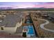 This aerial view highlights the property's backyard pool, patio, and surrounding neighborhood at 11991 Rockview Point St, Las Vegas, NV 89138