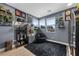 Cozy bedroom filled with plants, art and natural light from the windows at 11991 Rockview Point St, Las Vegas, NV 89138