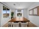 Charming dining room features modern table, stylish chairs, and natural light at 11991 Rockview Point St, Las Vegas, NV 89138