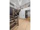 Bright entryway features modern staircase with wood treads and metal railings, and light wood floors at 11991 Rockview Point St, Las Vegas, NV 89138