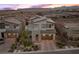 This modern two-story home features a well-manicured front yard and a two-car garage at 11991 Rockview Point St, Las Vegas, NV 89138