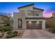 Contemporary two-story home with a modern design, well-manicured landscaping, and a spacious driveway at 11991 Rockview Point St, Las Vegas, NV 89138