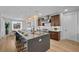 Gorgeous kitchen with large center island, stainless steel appliances, and stylish pendant lighting at 11991 Rockview Point St, Las Vegas, NV 89138