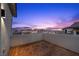 Outdoor patio showcasing wood-look decking and a privacy wall with views of the surrounding neighborhood at 11991 Rockview Point St, Las Vegas, NV 89138