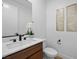 Stylish powder room with modern vanity, black faucet and decorative wall art at 11991 Rockview Point St, Las Vegas, NV 89138