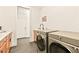 Modern laundry room featuring sleek cabinets, stainless steel washer and dryer at 12103 Canyon Sunset St, Las Vegas, NV 89138