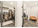 Well-organized walk-in closet with shelves and an orange chair in the back at 12103 Canyon Sunset St, Las Vegas, NV 89138