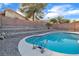 Backyard swimming pool with rock landscaping and tiered garden bed at 1820 Montvale Ct, Las Vegas, NV 89134