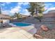 Backyard swimming pool with rock landscaping and tiered garden bed at 1820 Montvale Ct, Las Vegas, NV 89134