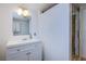 Modern bathroom featuring a white vanity and glass-enclosed shower at 1912 Margarita Ave, Henderson, NV 89011