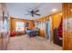 Cozy bedroom with wood paneling, carpet and a ceiling fan at 1912 Margarita Ave, Henderson, NV 89011