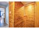 Unique hallway features wood walls and a view into another room at 1912 Margarita Ave, Henderson, NV 89011