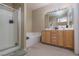 Bathroom featuring a shower, soaking tub, double vanity, and modern lighting at 214 Roxborough St, Henderson, NV 89074