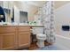 Bathroom with a toilet, bath tub with shower and vanity at 214 Roxborough St, Henderson, NV 89074