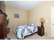 Bedroom with a cozy bed, neutral walls, and warm lamp lighting at 214 Roxborough St, Henderson, NV 89074