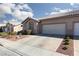 Attractive single-story house with a two-car garage, nestled in a desert-landscaped environment at 214 Roxborough St, Henderson, NV 89074