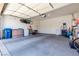 A spacious garage features a white door and plenty of storage with a water heater and boxes at 214 Roxborough St, Henderson, NV 89074