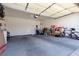 This garage is large with a white door, and there is plenty of extra room for storage and other items at 214 Roxborough St, Henderson, NV 89074