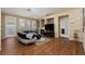 Spacious living room featuring vaulted ceilings, a fireplace and hardwood floors at 214 Roxborough St, Henderson, NV 89074