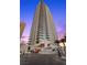 Striking high-rise building showcasing modern architecture with multiple balconies with palm trees at 2700 Las Vegas Blvd # 809, Las Vegas, NV 89109