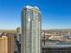 Modern high-rise featuring private balconies and reflective glass, with mountains in the background, near the convention center at 2700 Las Vegas Blvd # 809, Las Vegas, NV 89109