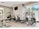 Brightly lit gym with cardio equipment, weight machines, and a TV at 2700 Las Vegas Blvd # 809, Las Vegas, NV 89109