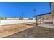 Spacious dirt backyard with block wall and covered patio area at 3314 El Camino Real, Las Vegas, NV 89121