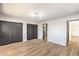 Bedroom with wood flooring, modern light fixture, and large closet space at 3314 El Camino Real, Las Vegas, NV 89121