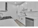 Modern kitchen featuring white cabinets, stainless steel appliances, and white countertops at 3318 N Decatur Blvd # 1035, Las Vegas, NV 89130