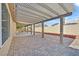 Rear patio features a covered area and patterned brick pavers, perfect for outdoor enjoyment at 3514 Jordan Ln, North Las Vegas, NV 89032