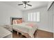 Cozy bedroom featuring warm hardwood floors, ceiling fan, and window for comfortable living at 3514 Jordan Ln, North Las Vegas, NV 89032