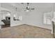 Open-concept living area with tile floors, neutral paint and modern furnishings at 3514 Jordan Ln, North Las Vegas, NV 89032