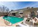 Inviting backyard pool with modern lounge furniture perfect for relaxing and entertaining at 3696 Monte Verde St, Las Vegas, NV 89121