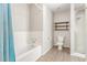 Bathroom featuring a shower/tub combination and storage shelving at 3696 Monte Verde St, Las Vegas, NV 89121