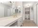 Bright bathroom featuring a long vanity, dual mirrors, and a walk-in shower at 3696 Monte Verde St, Las Vegas, NV 89121