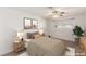 Staged bedroom featuring neutral tones, updated lighting, and large window at 3696 Monte Verde St, Las Vegas, NV 89121