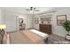 Staged main bedroom featuring ample closet space, a vanity, and bright window at 3696 Monte Verde St, Las Vegas, NV 89121